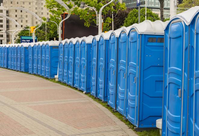 portable restrooms with sink and hand sanitizer stations, available at a festival in Ingleside